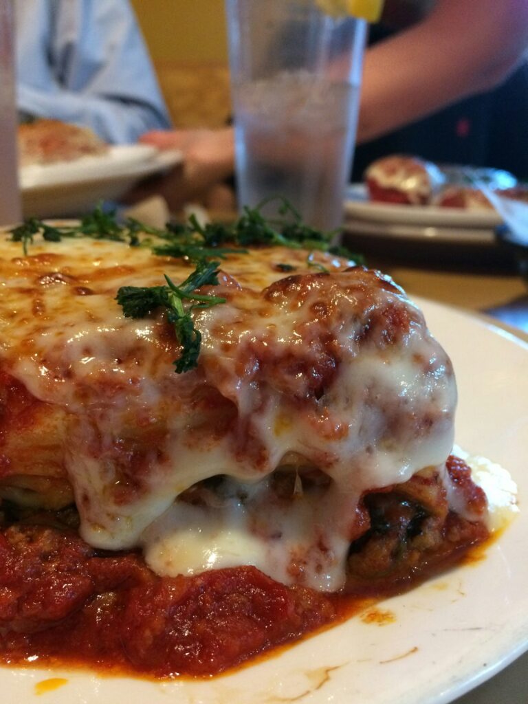 Italian food night with a delicious lasagna. Restaurant night. Dinning out. Depth of field.
